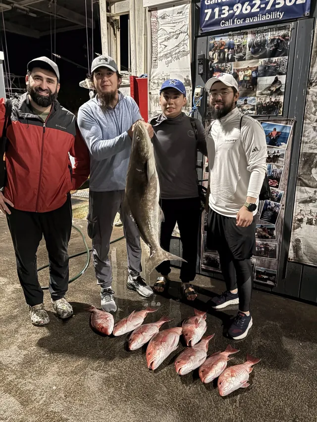 Four anglers at the Galveston Offshore dock with a cobia and red snapper at the end of a federal offshore trip