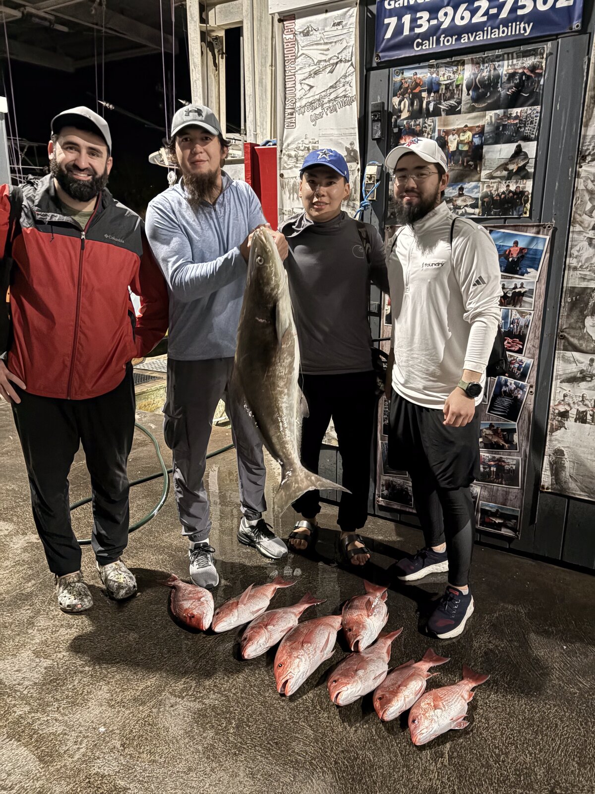 Four anglers at the Galveston Offshore dock with a cobia and red snapper at the end of a federal offshore trip