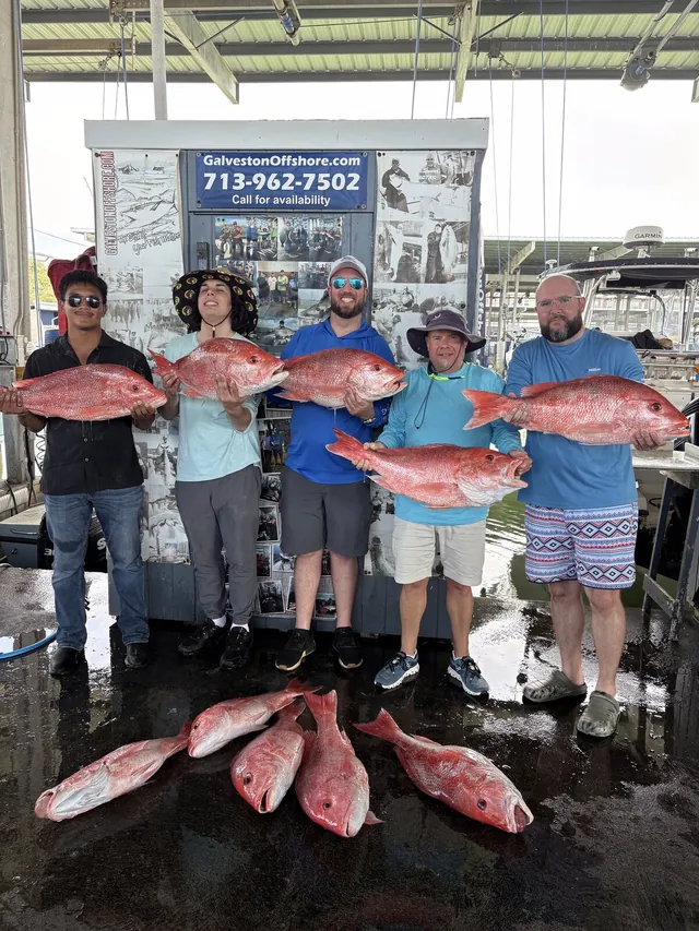 Five anglers at the Galveston Offshore sign holding red snapper after a federal offshore charter