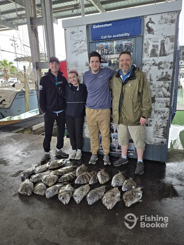 Four anglers with a snapper haul at the Galveston dock