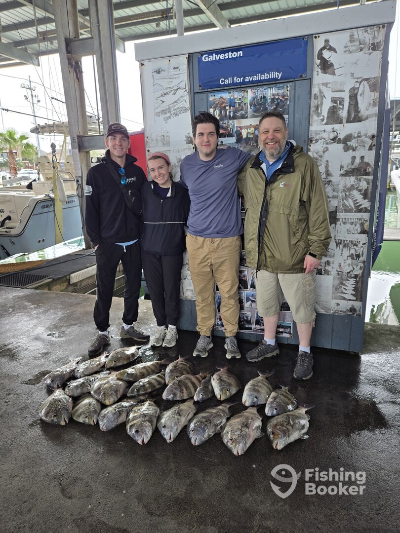 Four anglers with a snapper haul at the Galveston dock