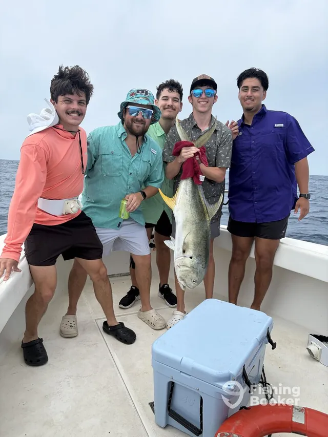 A charter group celebrating their catch aboard the Half Time off Galveston