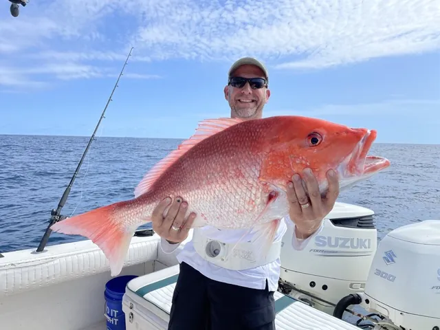 A large red snapper held up on the deck after a federal offshore run out of Galveston